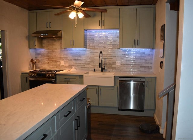 kitchen featuring appliances with stainless steel finishes, backsplash, extractor fan, ceiling fan, and sink