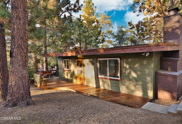 view of home's exterior featuring a deck