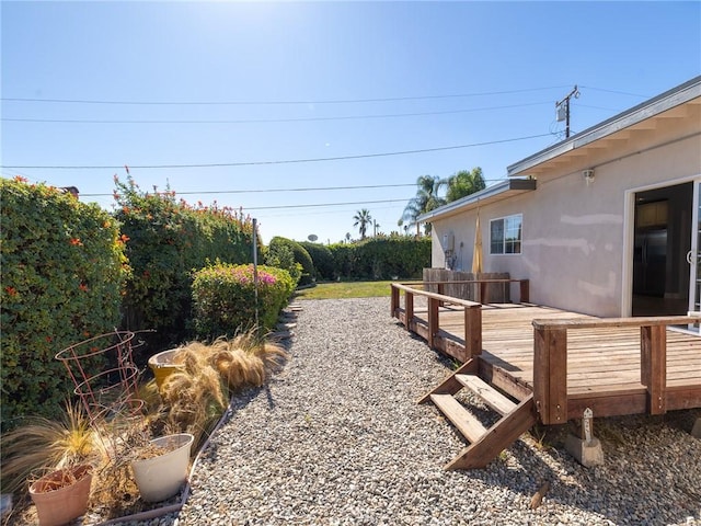 view of yard with a wooden deck