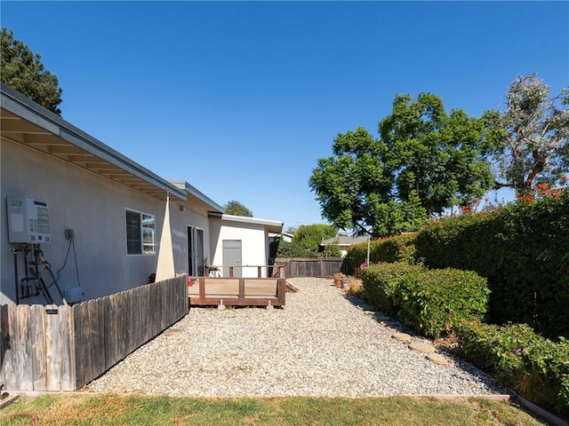 view of yard featuring a wooden deck