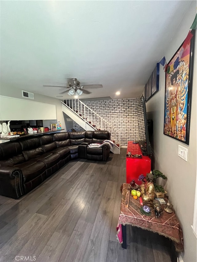 living room featuring hardwood / wood-style flooring and ceiling fan