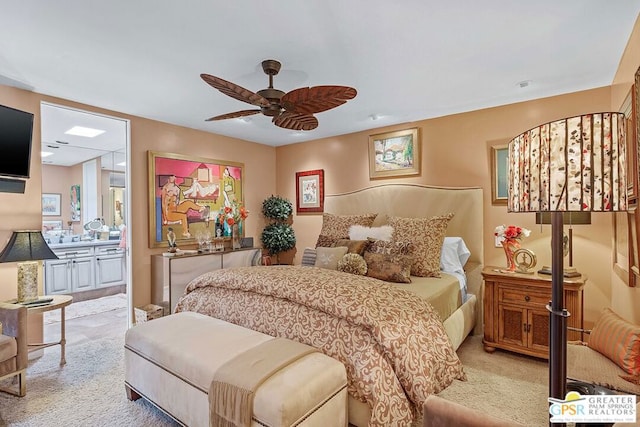 bedroom featuring connected bathroom, ceiling fan, and light carpet