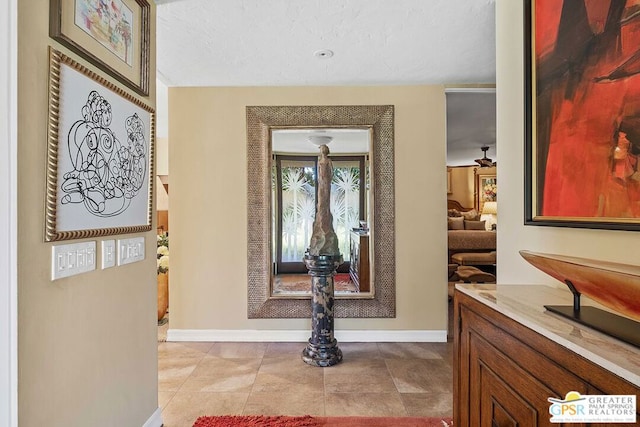 interior space featuring ceiling fan