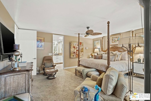 carpeted bedroom featuring ensuite bath and ceiling fan