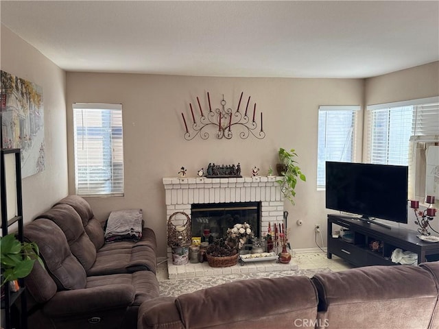 living room featuring a brick fireplace