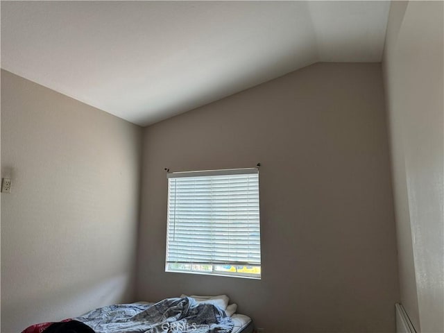 bedroom with vaulted ceiling