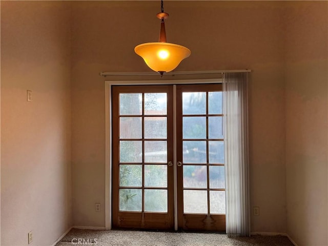 doorway with carpet and french doors