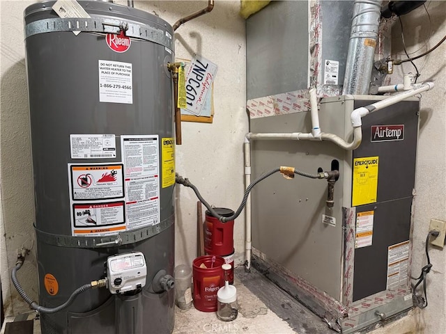 utility room with heating unit and water heater