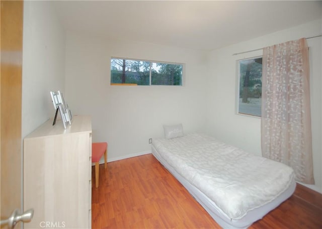 bedroom with hardwood / wood-style flooring