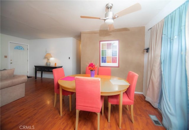 dining space featuring hardwood / wood-style flooring and ceiling fan