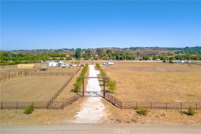 birds eye view of property with a rural view