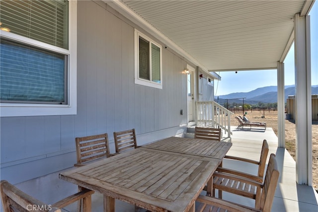 view of patio / terrace with a mountain view