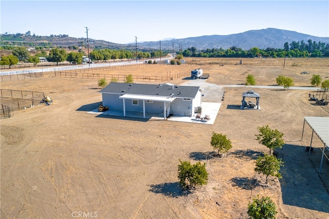 aerial view featuring a mountain view and a rural view