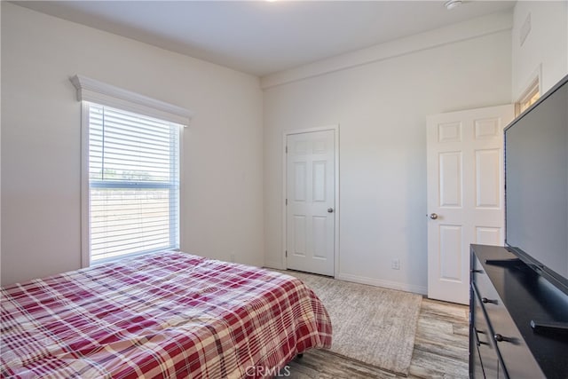 bedroom featuring light wood-type flooring