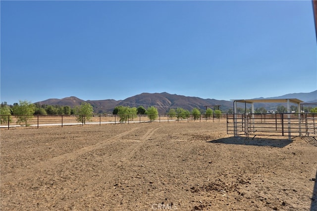 view of mountain feature with a rural view