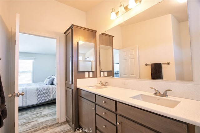 bathroom featuring hardwood / wood-style floors and vanity