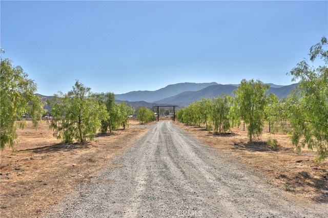 view of street with a mountain view and a rural view