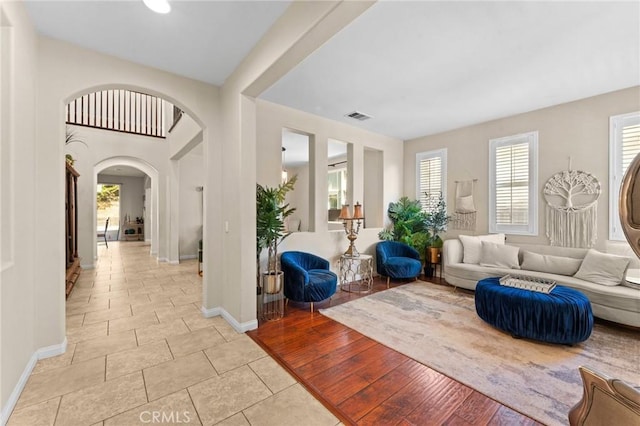 living room with plenty of natural light and light hardwood / wood-style floors