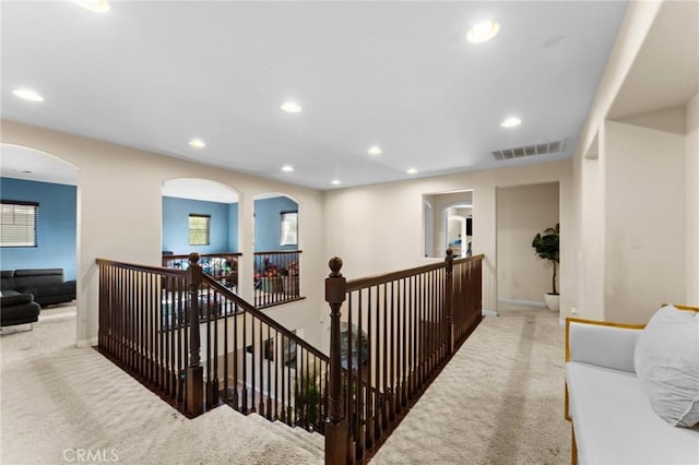 hallway with carpet floors