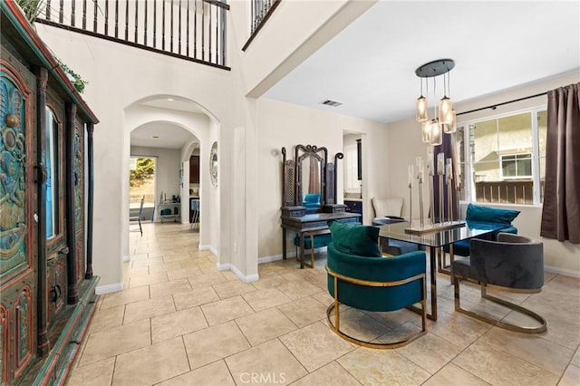 entrance foyer featuring a chandelier and light tile patterned floors