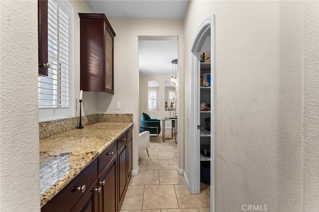 hallway featuring light tile patterned flooring