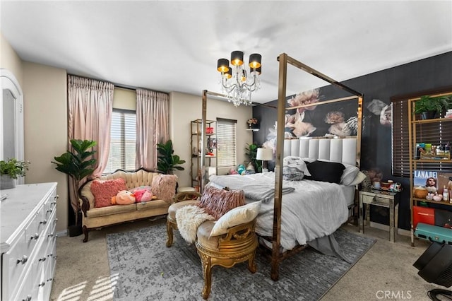 carpeted bedroom featuring an inviting chandelier