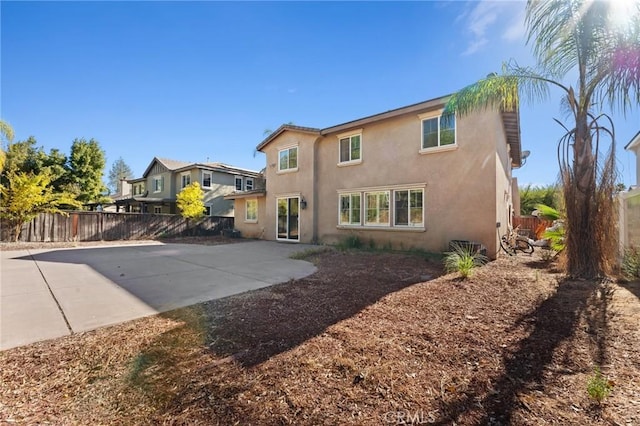 rear view of property with a patio area