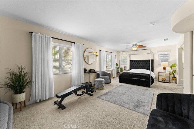 carpeted bedroom featuring ceiling fan