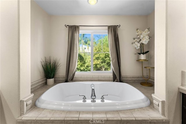 bathroom featuring tiled bath