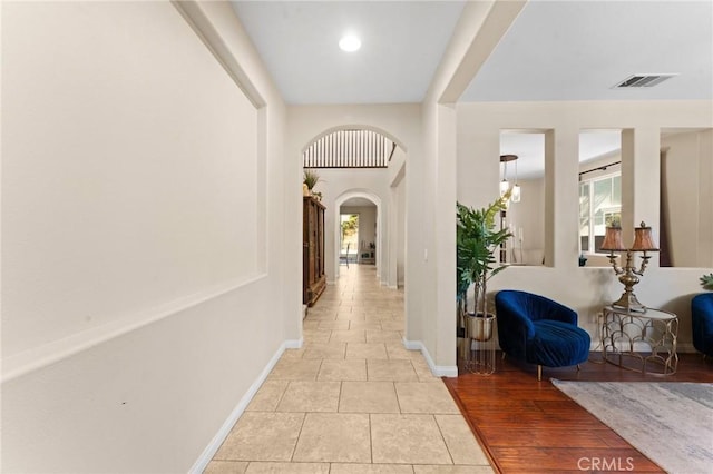 corridor featuring light hardwood / wood-style floors