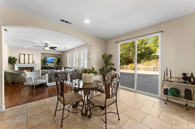 dining space featuring plenty of natural light, ceiling fan, and light hardwood / wood-style flooring