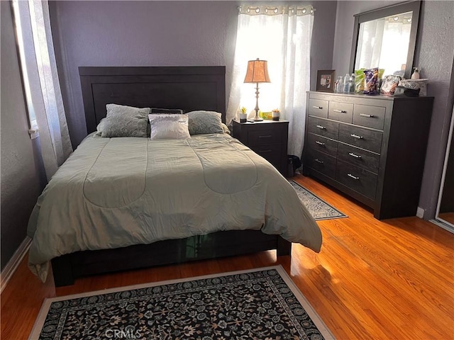 bedroom featuring light hardwood / wood-style flooring