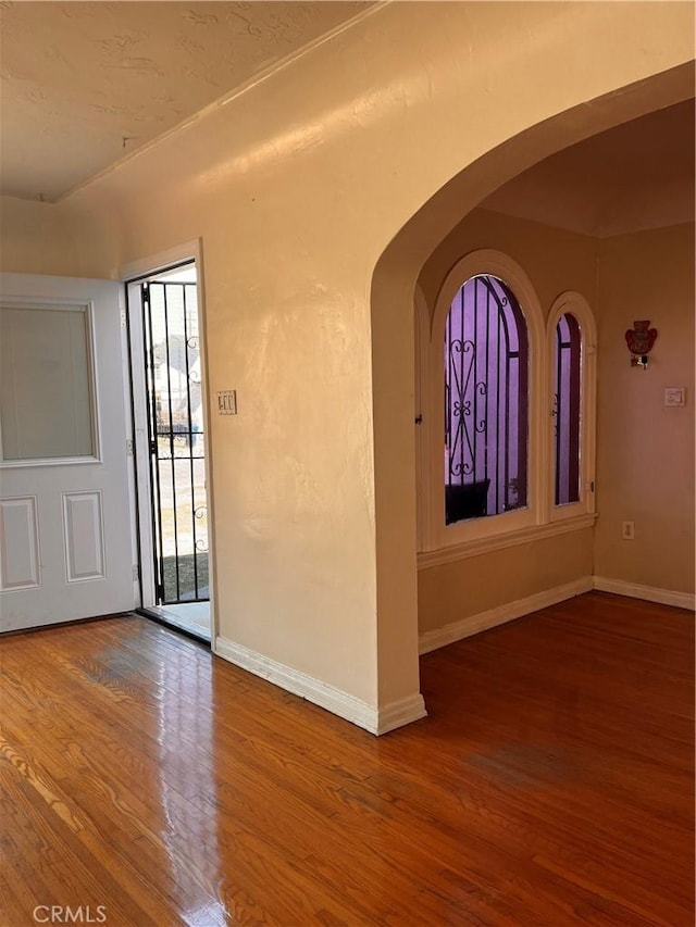 empty room with wood-type flooring