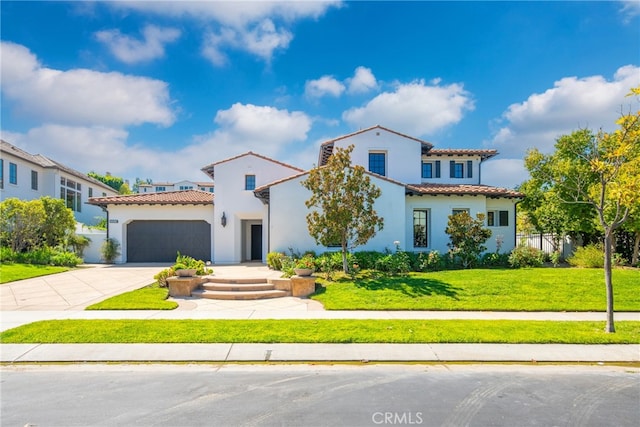 mediterranean / spanish-style home with a front lawn and a garage