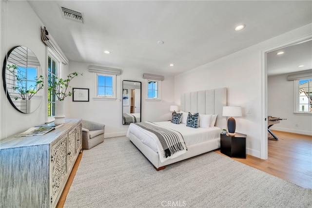 bedroom with light hardwood / wood-style floors