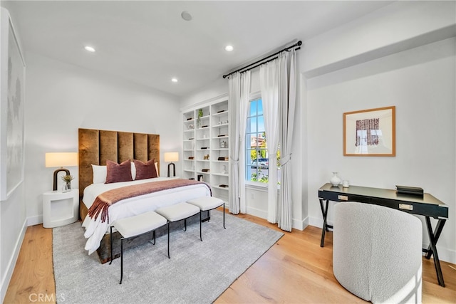 bedroom with light hardwood / wood-style flooring