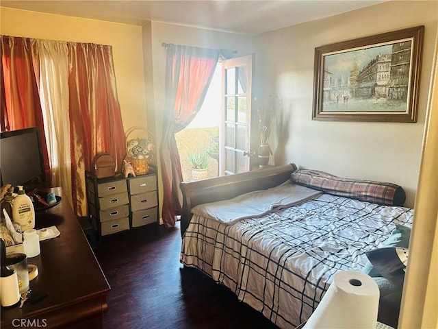 bedroom featuring dark wood-type flooring