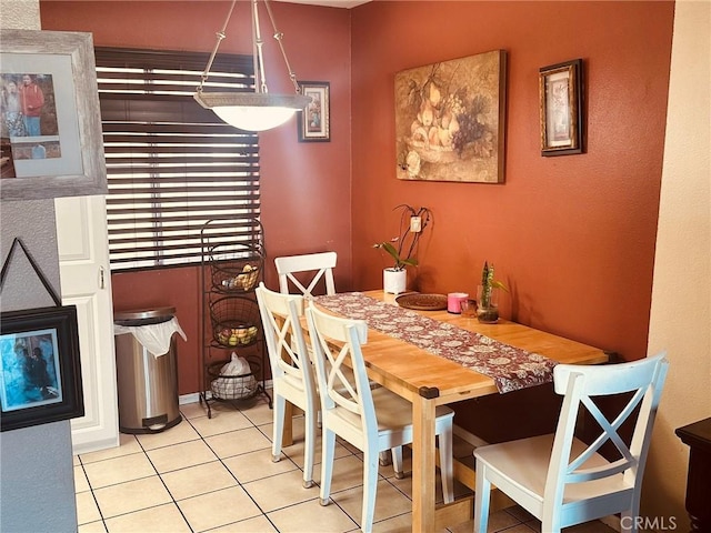 dining space with light tile patterned floors