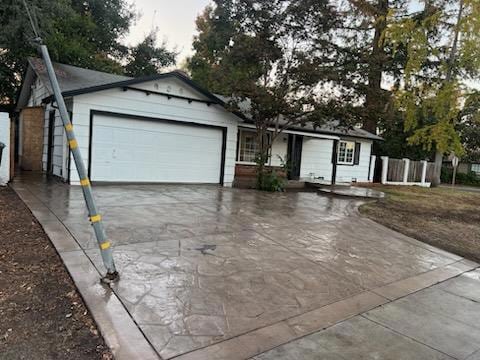 ranch-style house featuring a garage