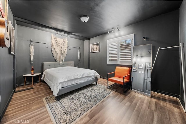 bedroom featuring wood-type flooring