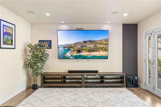 home theater featuring light hardwood / wood-style flooring