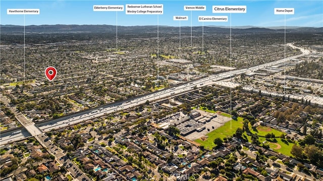 birds eye view of property featuring a mountain view