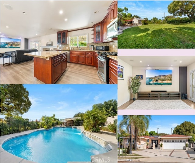 view of pool with pool water feature and an outdoor kitchen