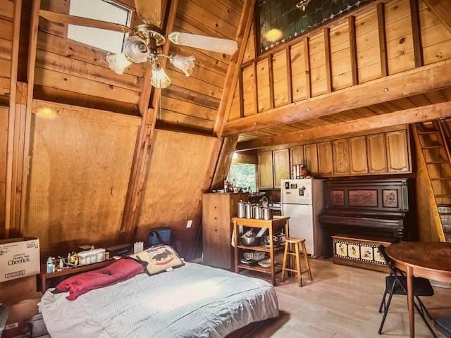 bedroom featuring high vaulted ceiling, light hardwood / wood-style flooring, wooden ceiling, wooden walls, and white fridge