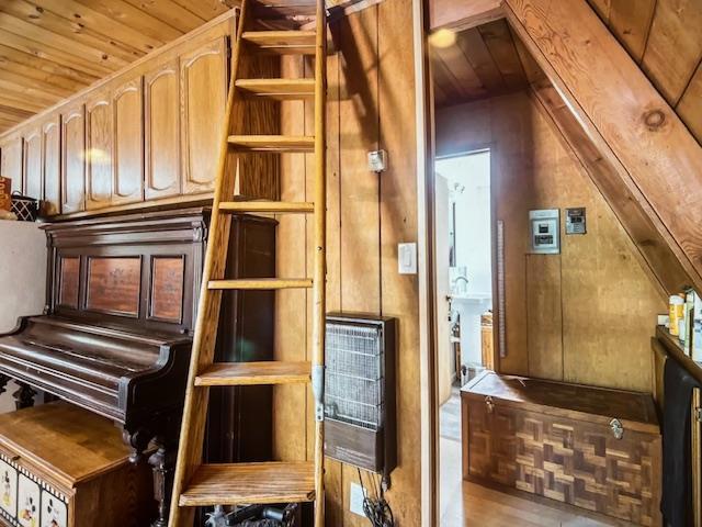 misc room featuring wood ceiling, wooden walls, and hardwood / wood-style flooring