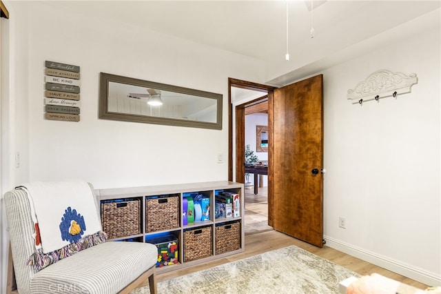 game room with light hardwood / wood-style flooring