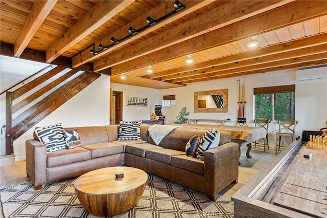 living room with light hardwood / wood-style floors, wood ceiling, track lighting, and an AC wall unit