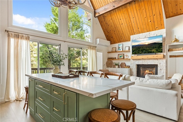 kitchen featuring plenty of natural light, a center island, and wooden ceiling