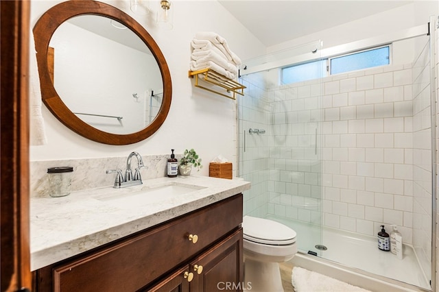 bathroom with toilet, walk in shower, and vanity