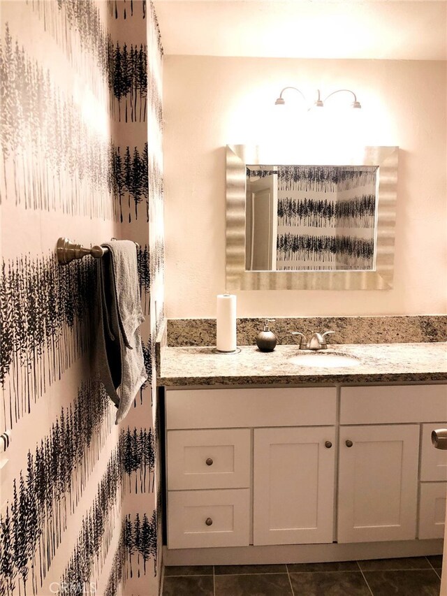 bathroom with tile patterned flooring and vanity